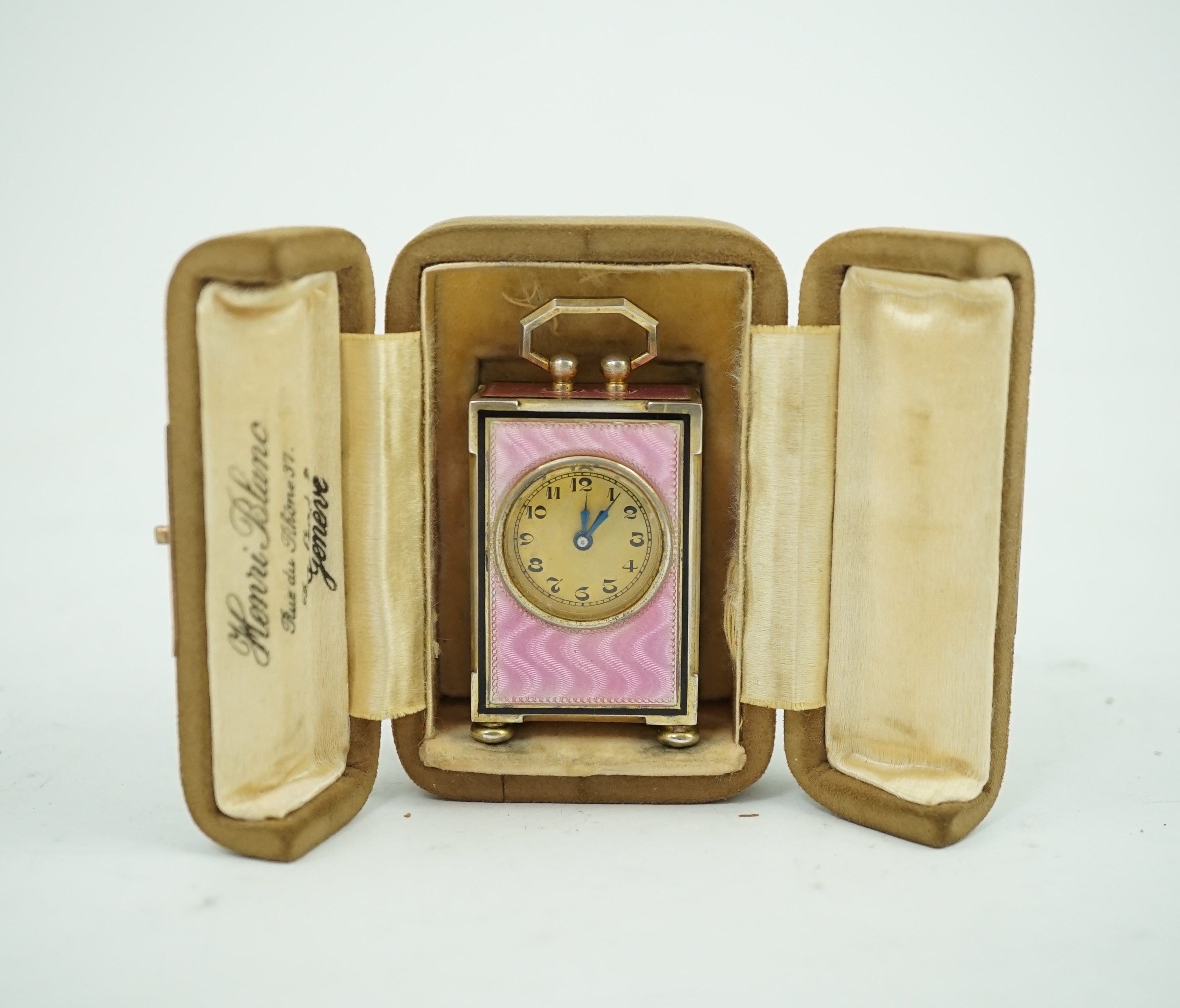 An early 20th century Swiss silver gilt and two colour enamel miniature carriage timepiece